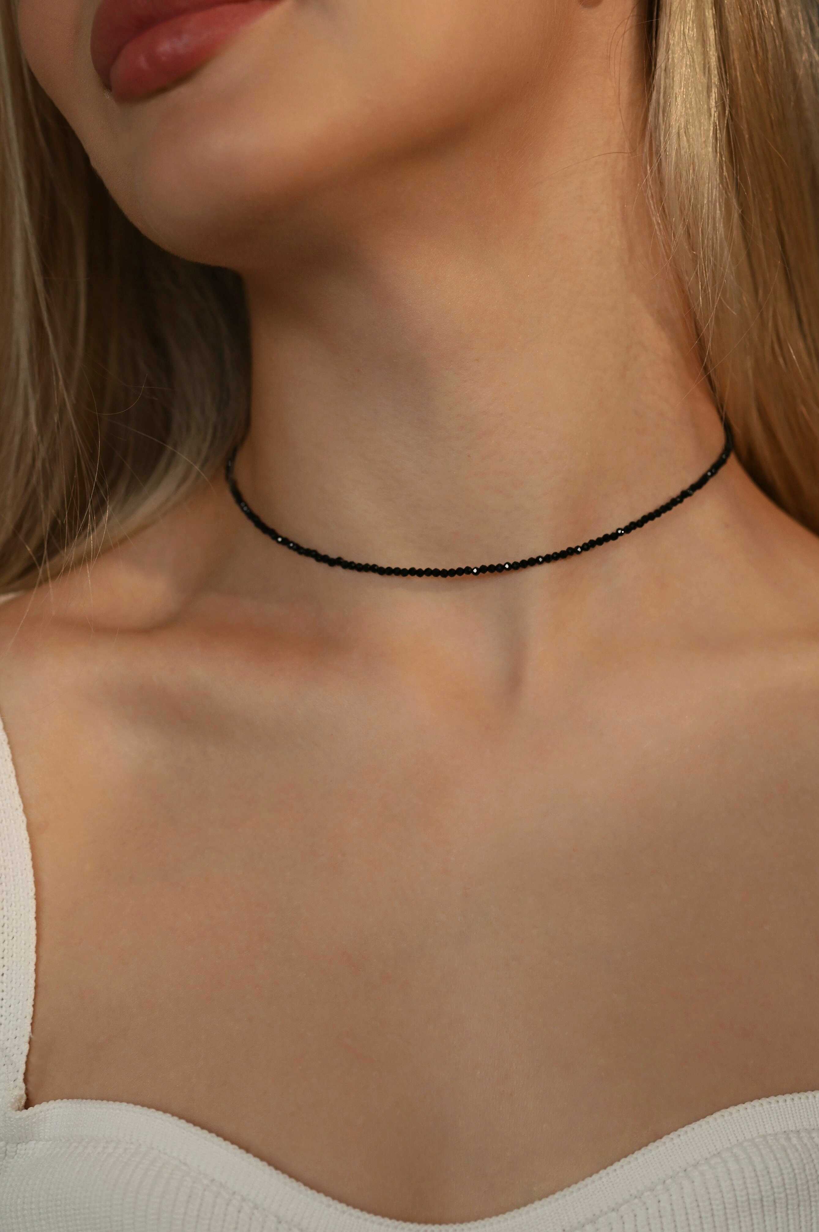 Black spinel choker necklace in gold-tone stainless steel with minimalist design, featuring natural black spinel gemstones on a delicate gold-colored chain, perfect for everyday wear and special occasions.