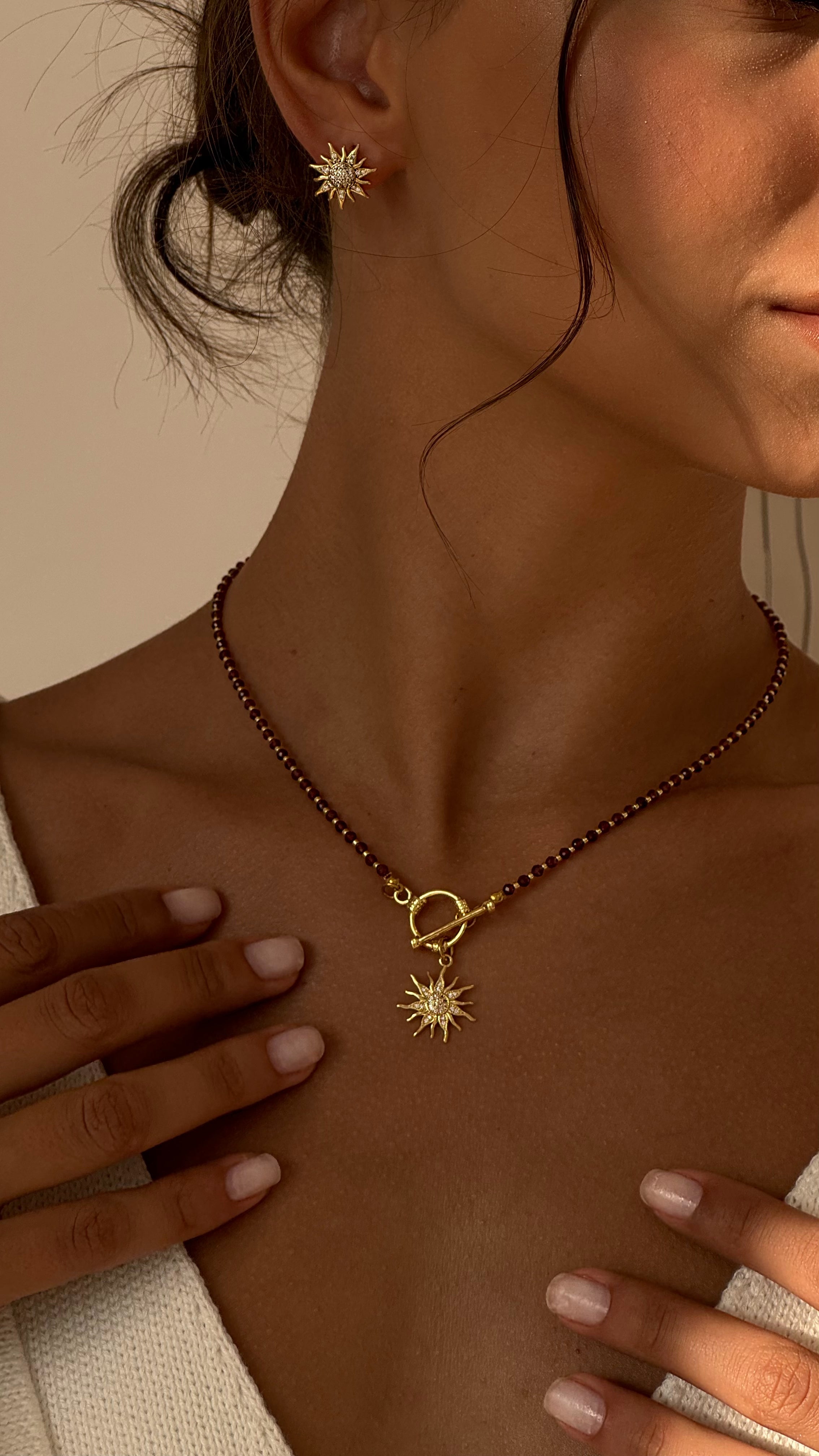 Garnet necklace with sun pendant and matching bohemian sun earrings — gold-plated jewelry set by Lamari