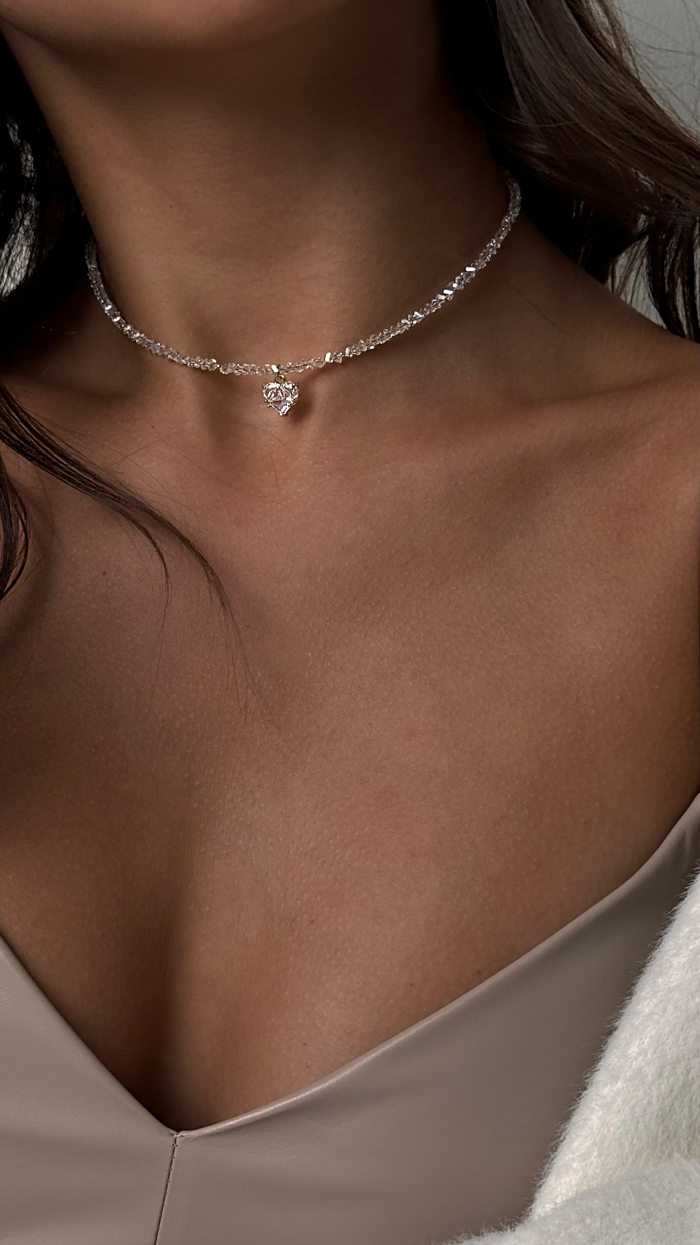 Elegant necklace with a crystal heart pendant on a delicate chain, perfect as an anniversary gift for her