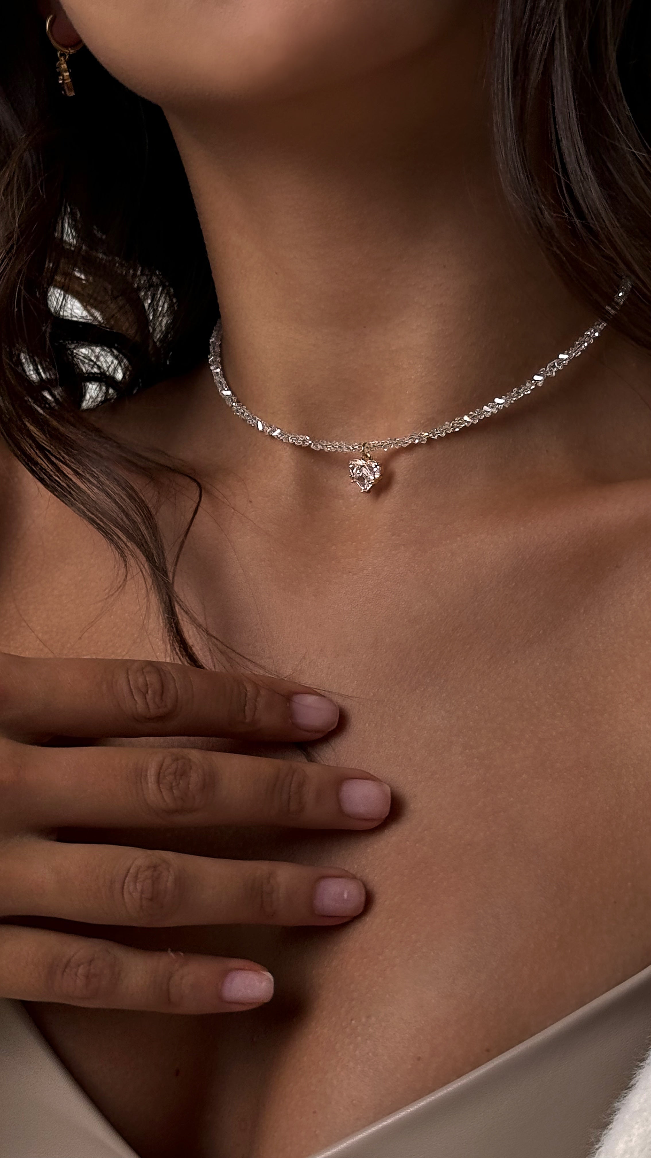 Choker made of transparent crystal beads with a heart-shaped charm — delicate and romantic design that adds subtle sparkle and femininity to any outfit.