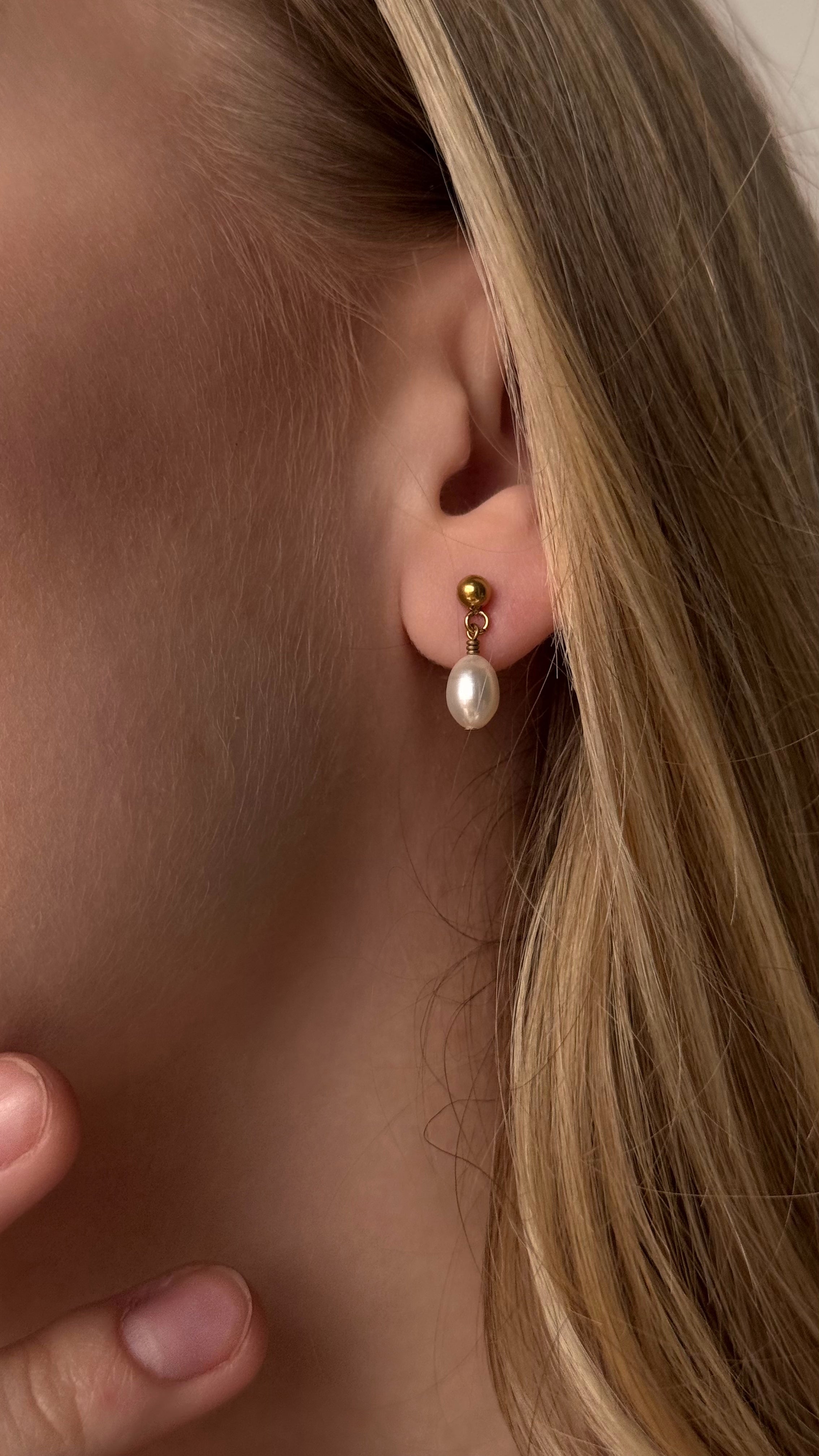 Delicate stud earrings featuring genuine natural pearls. Classic and elegant design perfect for everyday wear or special occasions. Lightweight and comfortable for all-day use.