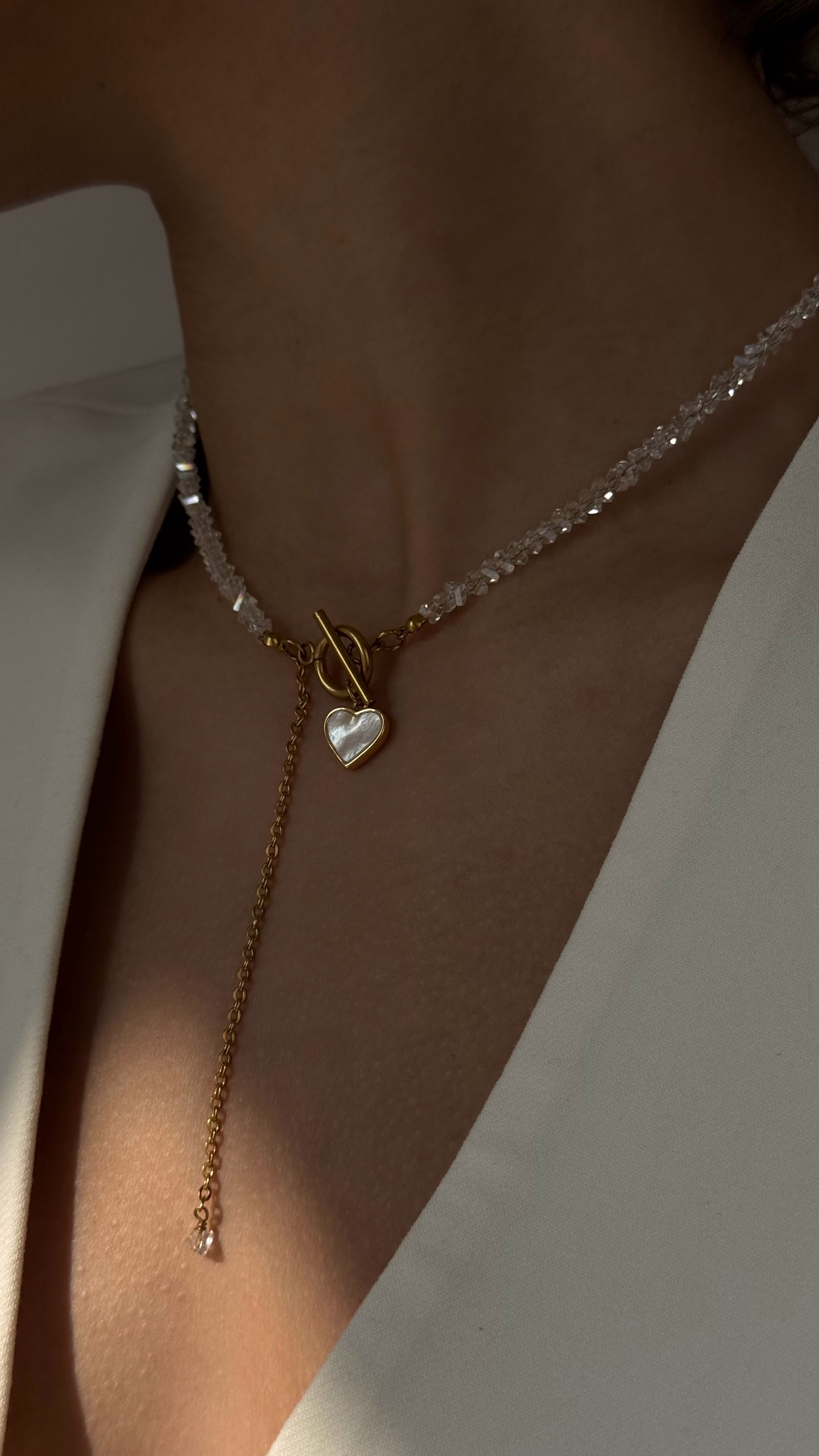 Dainty crystal necklace with mother-of-pearl heart pendant and gold-plated stud earrings – Lamari jewelry set for women