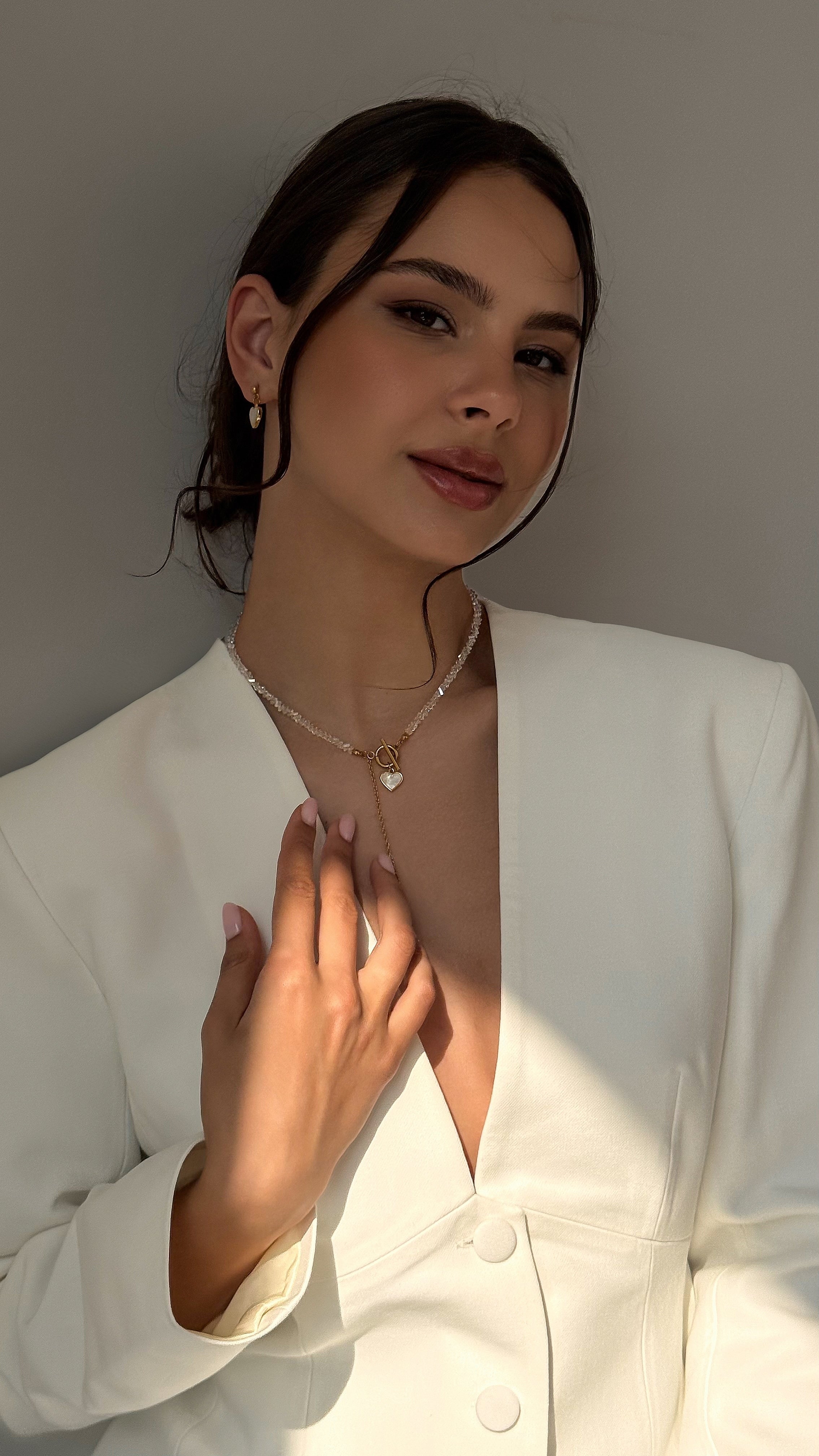 Crystal necklace with natural mother-of-pearl pendant — delicate and elegant design that adds soft shimmer and timeless charm to any look.