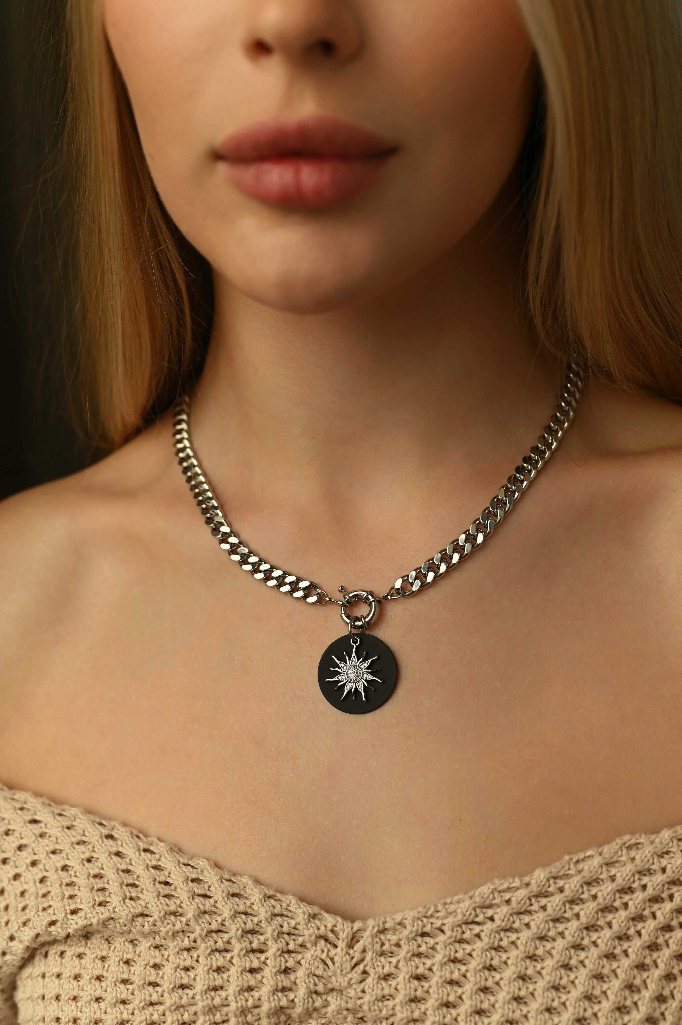 Bold chunky chain necklace with a sparkling detachable cubic zirconia pendant, crafted from rhodium-plated brass for a cool-toned, elegant shine.