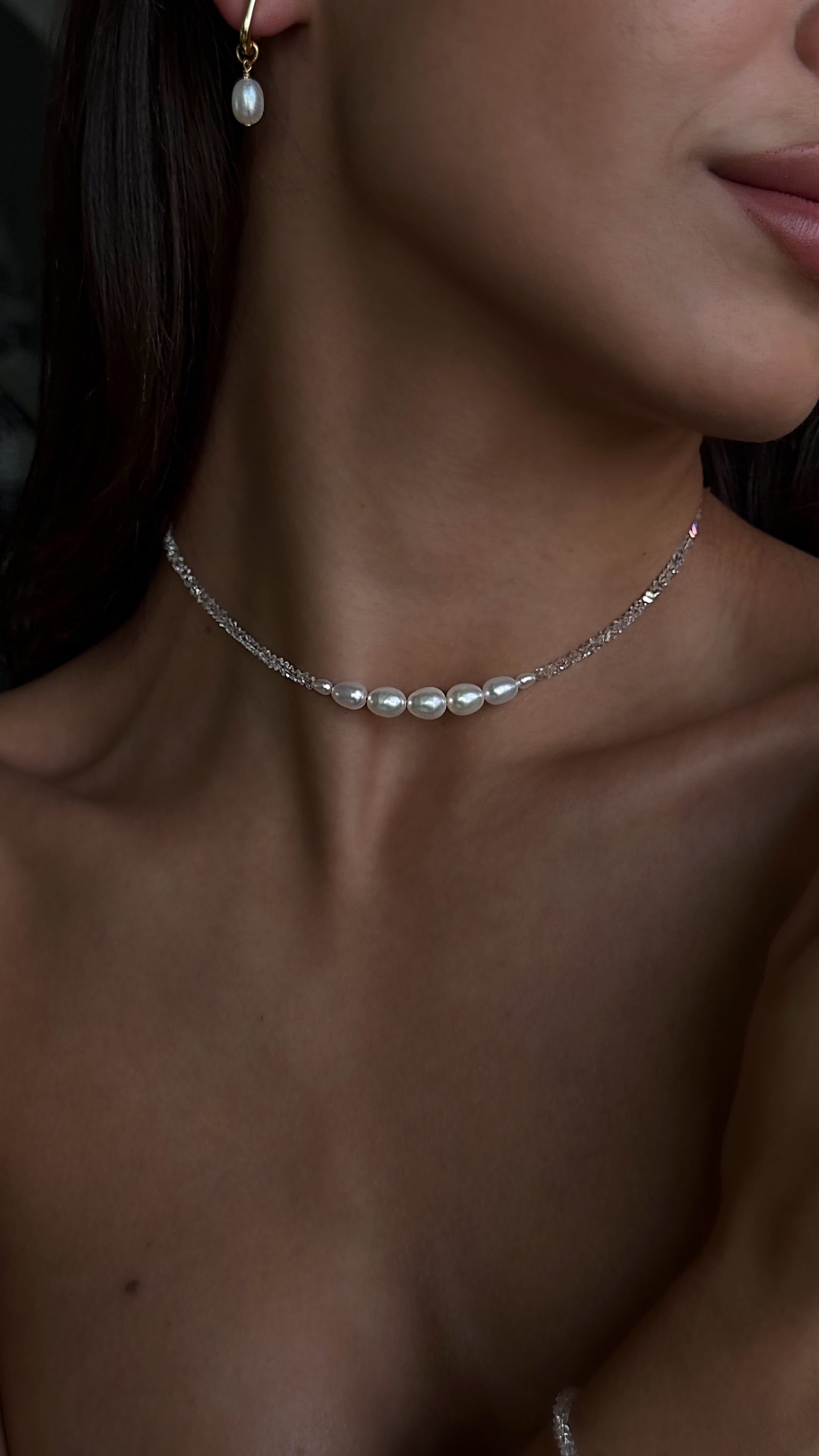 Choker with transparent crystal beads and natural freshwater pearls — delicate and elegant accessory adding subtle sparkle and timeless charm to any look.