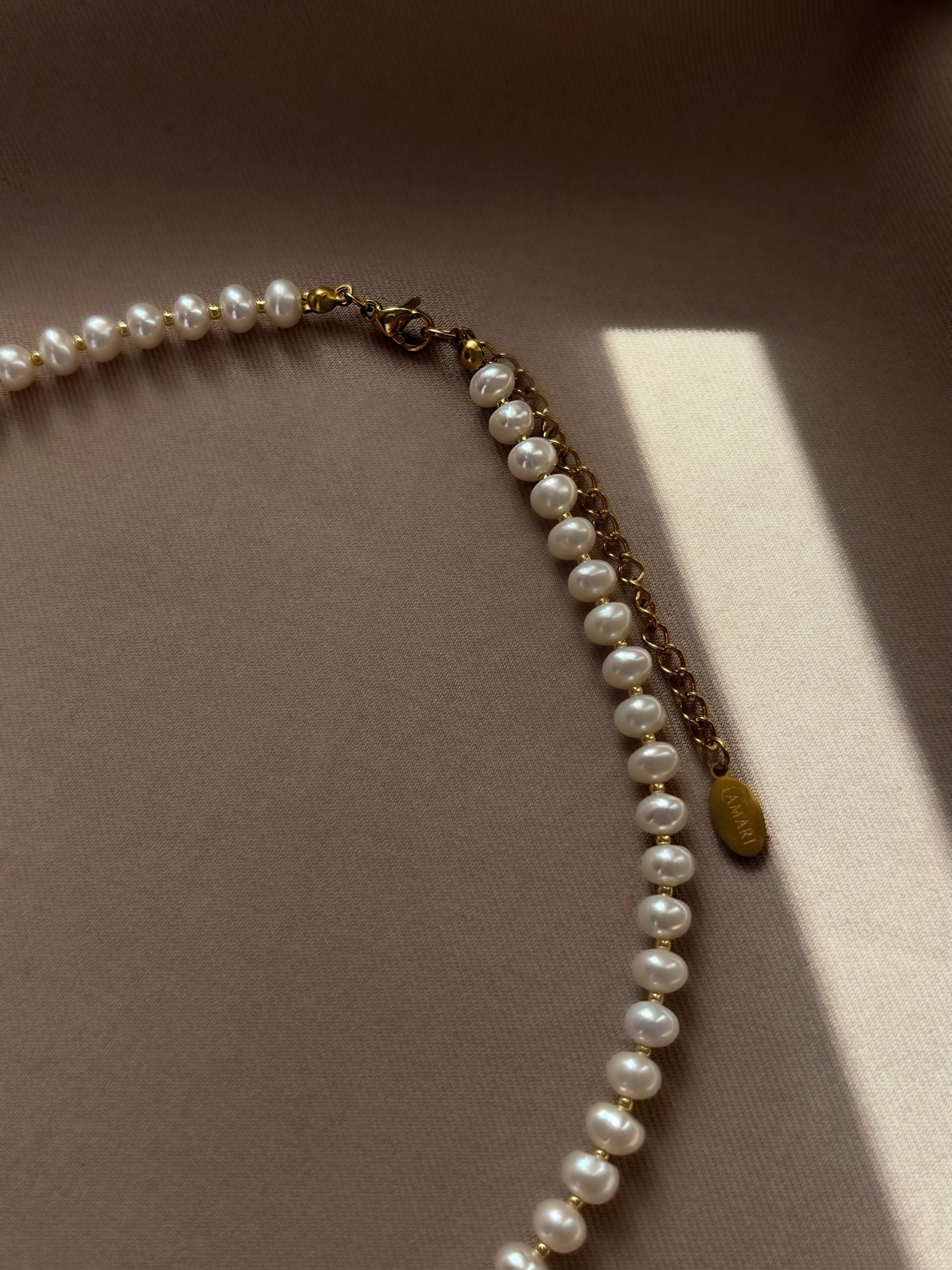 Delicate natural pearl choker featuring a unique mother-of-pearl heart pendant — soft, feminine, and timeless design that highlights grace and elegance for any occasion.