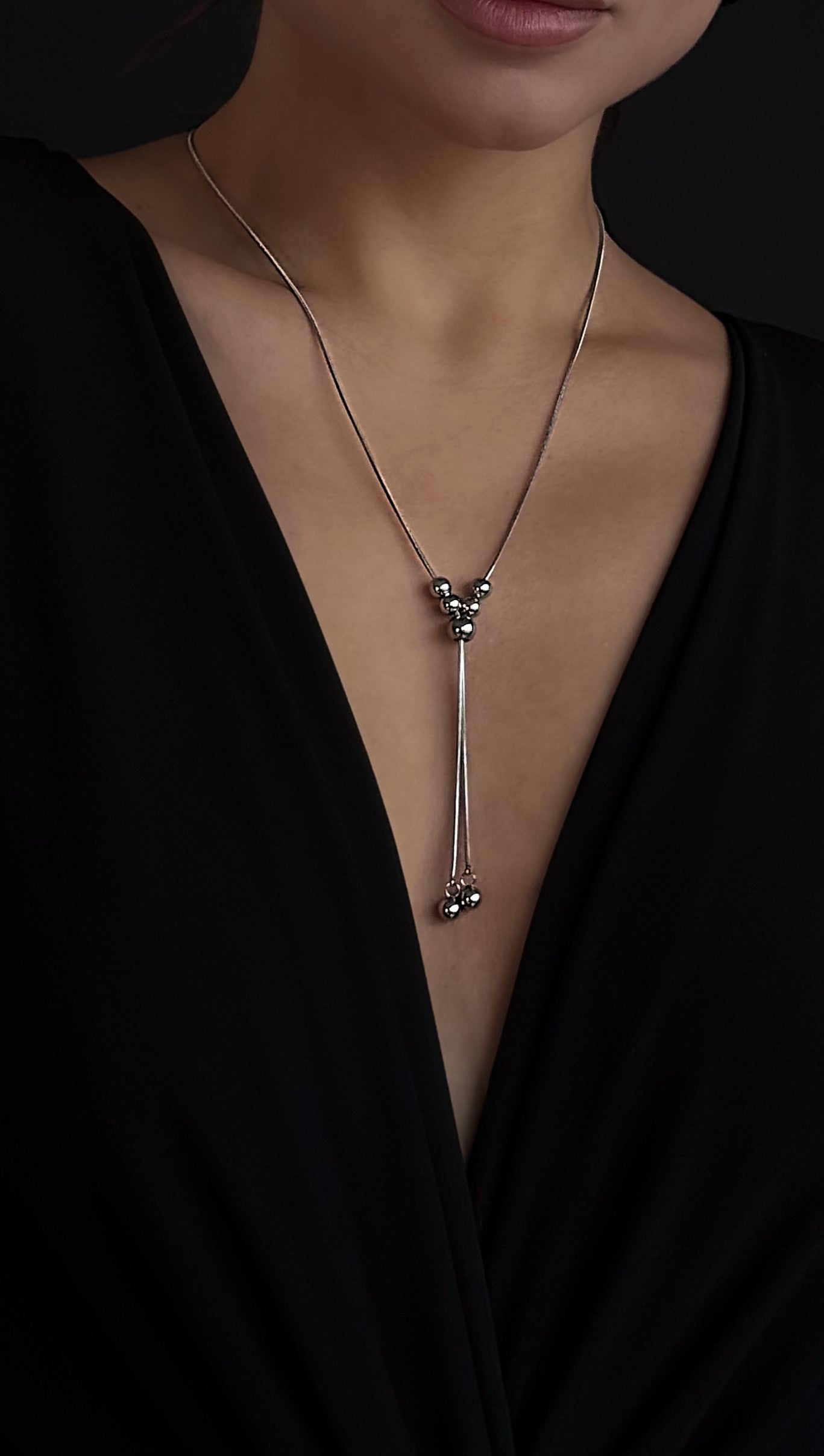 Trendy silver-tone lariat necklace made from jewelry-grade stainless steel, designed for versatile wear with multiple styling options and durable finish.