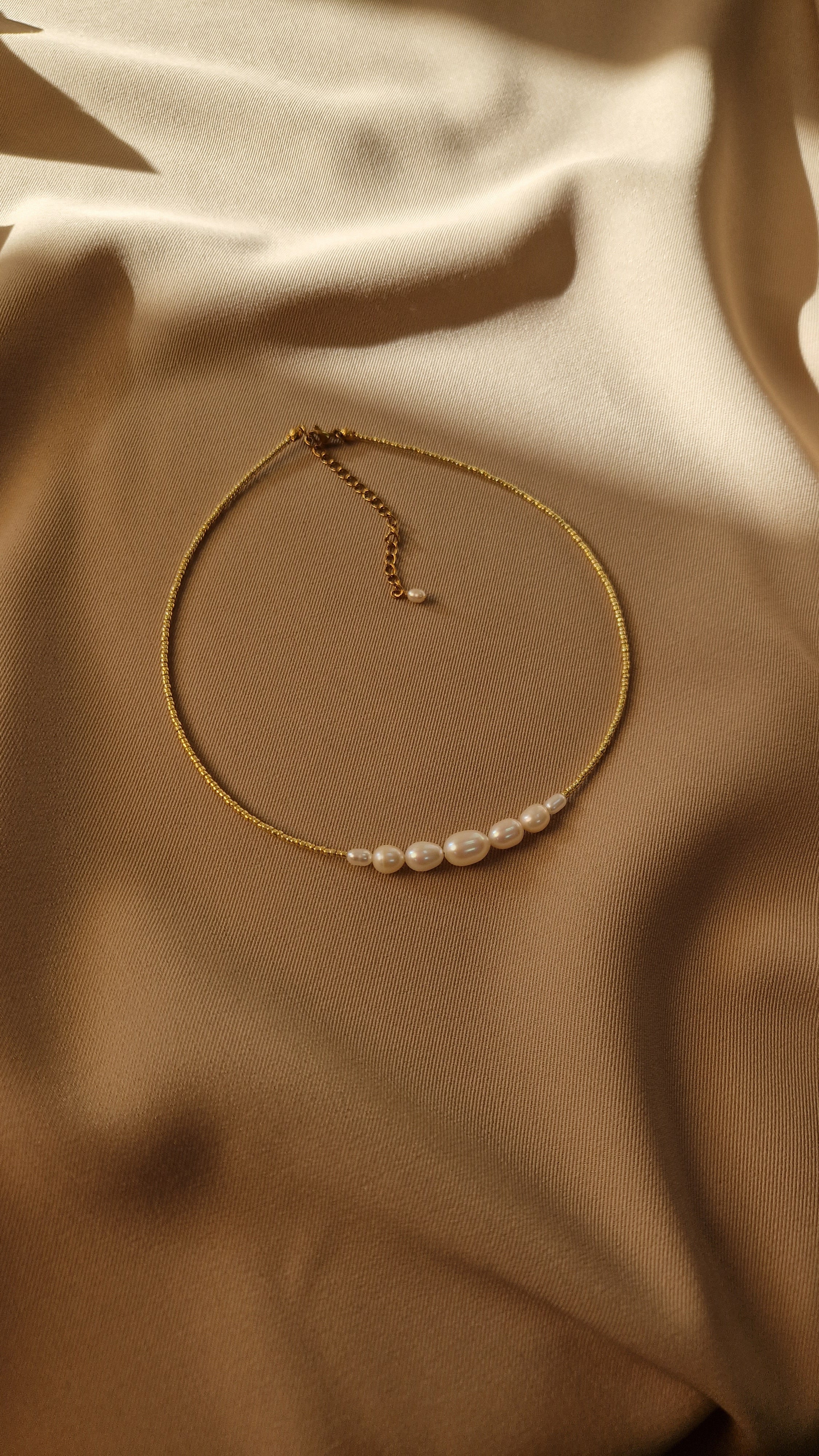 Delicate choker made of Japanese seed beads and natural freshwater pearls — graceful and minimalist design perfect for adding subtle elegance to any look.