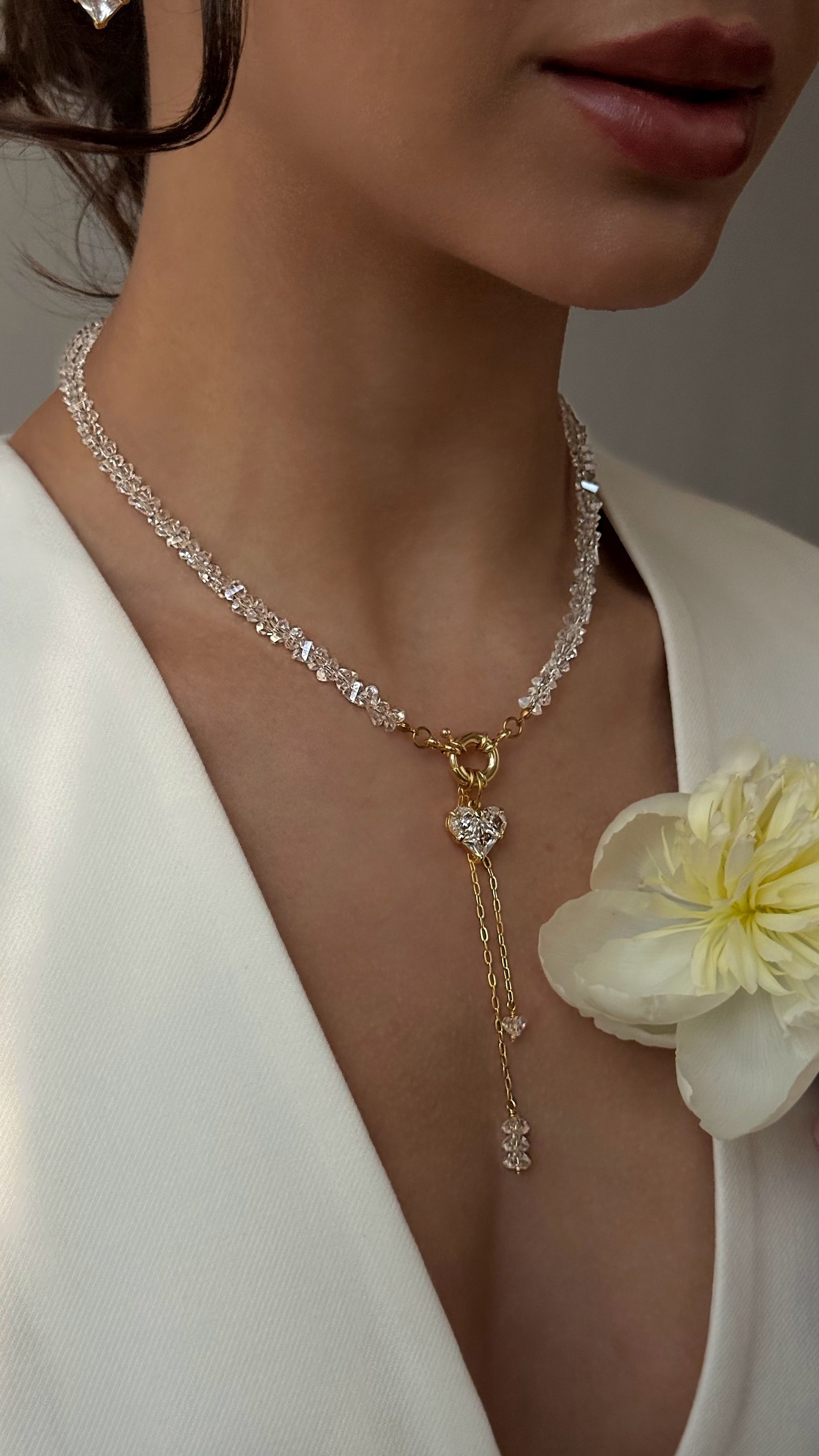 Refined necklace with hand-selected crystal beads and a heart-shaped pendant, offering delicate sparkle and romantic charm for any outfit.