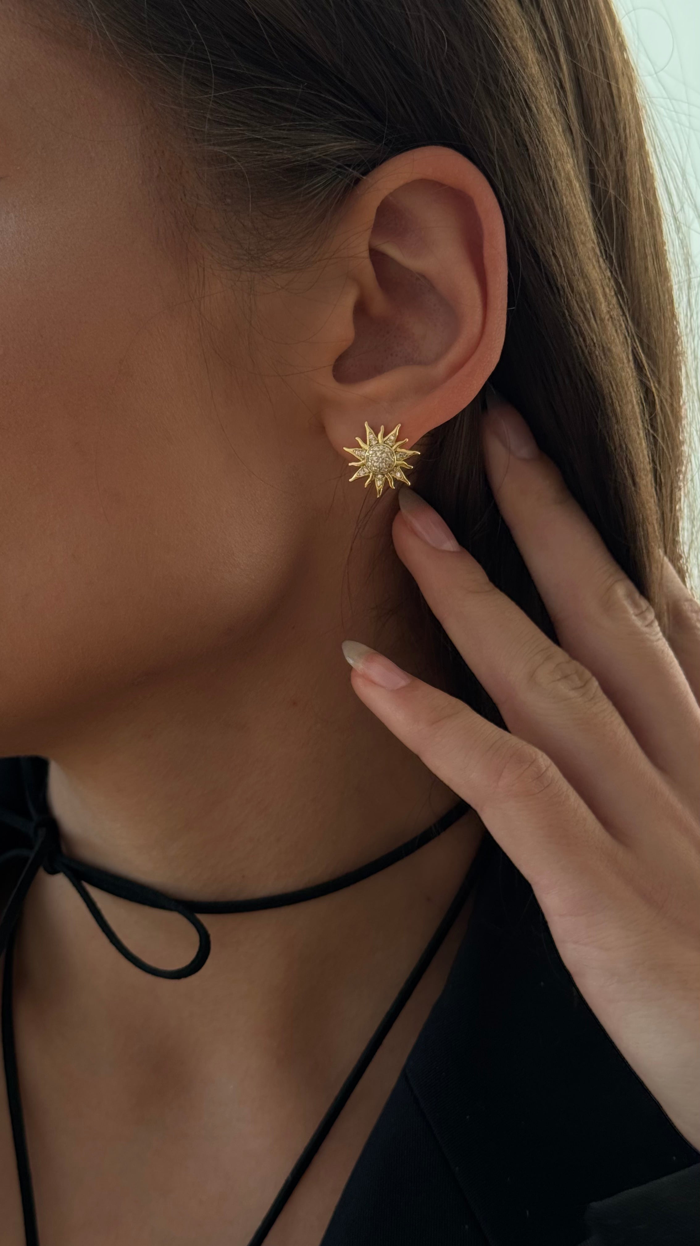 Elegant earrings adorned with shimmering cubic zirconia and finished with a secure English clasp, offering refined sparkle for everyday or special occasions.
