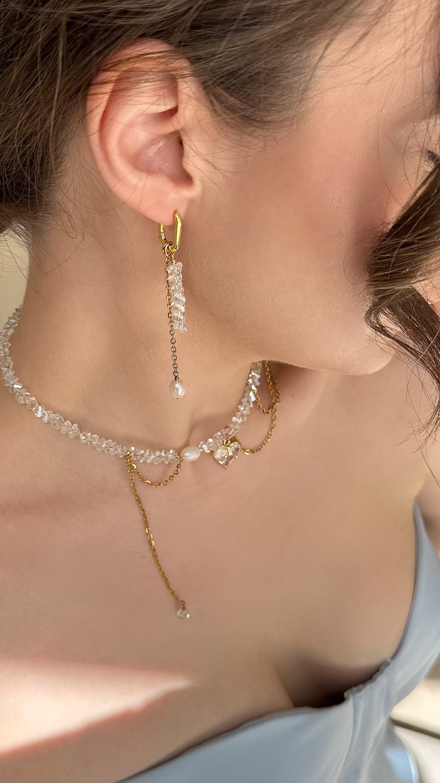 Crystal Heart Pendant Choker and Earrings Set featuring shimmering glass crystal beads, a delicate gold-tone heart pendant, and matching elegant earrings. The necklace has a refined chain design, combining sparkle and modern elegance—perfect for everyday wear or special occasions.