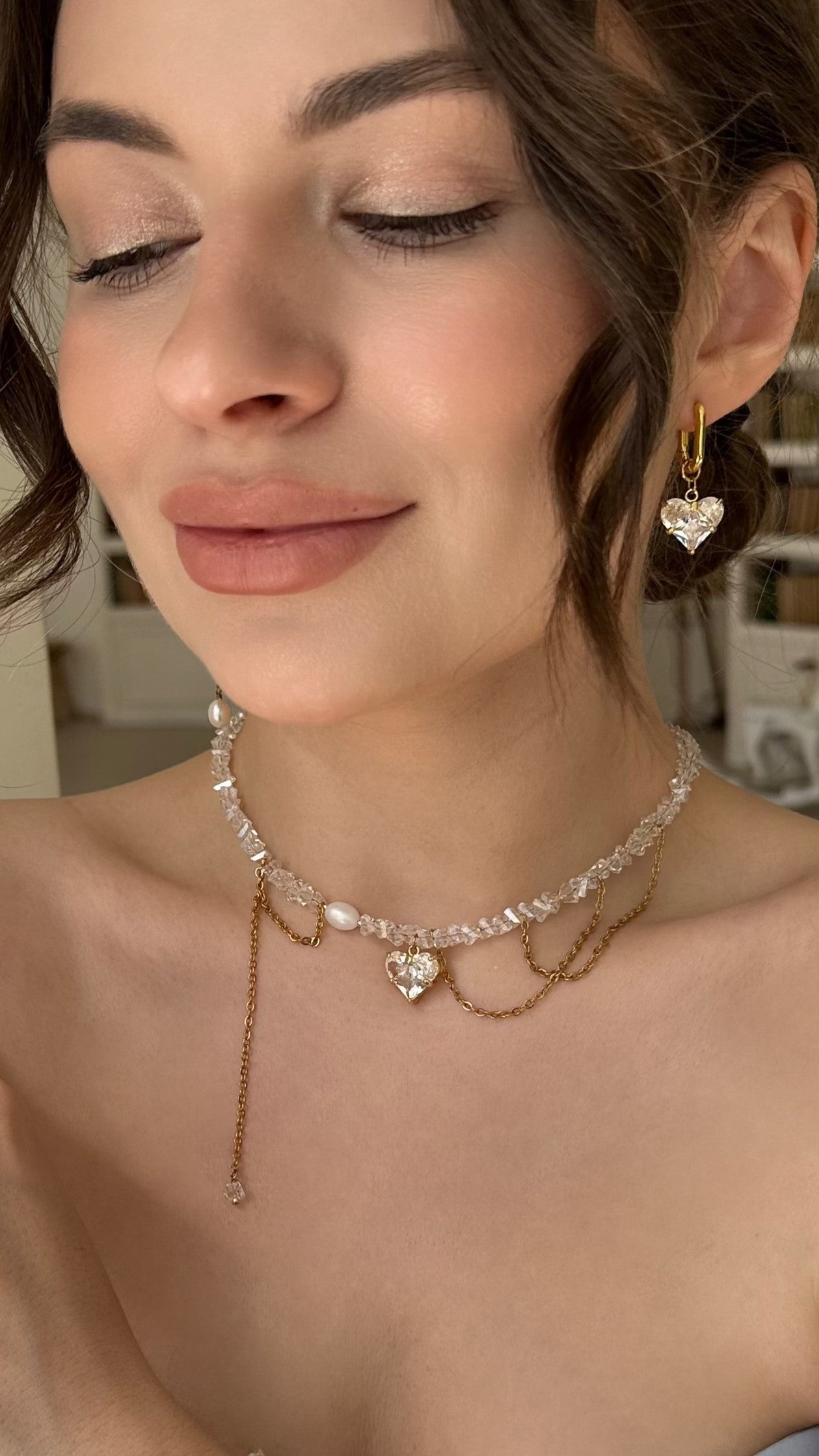 Crystal Heart Pendant Choker and Earrings Set featuring shimmering glass crystal beads, a delicate gold-tone heart pendant, and matching elegant earrings. The necklace has a refined chain design, combining sparkle and modern elegance—perfect for everyday wear or special occasions.