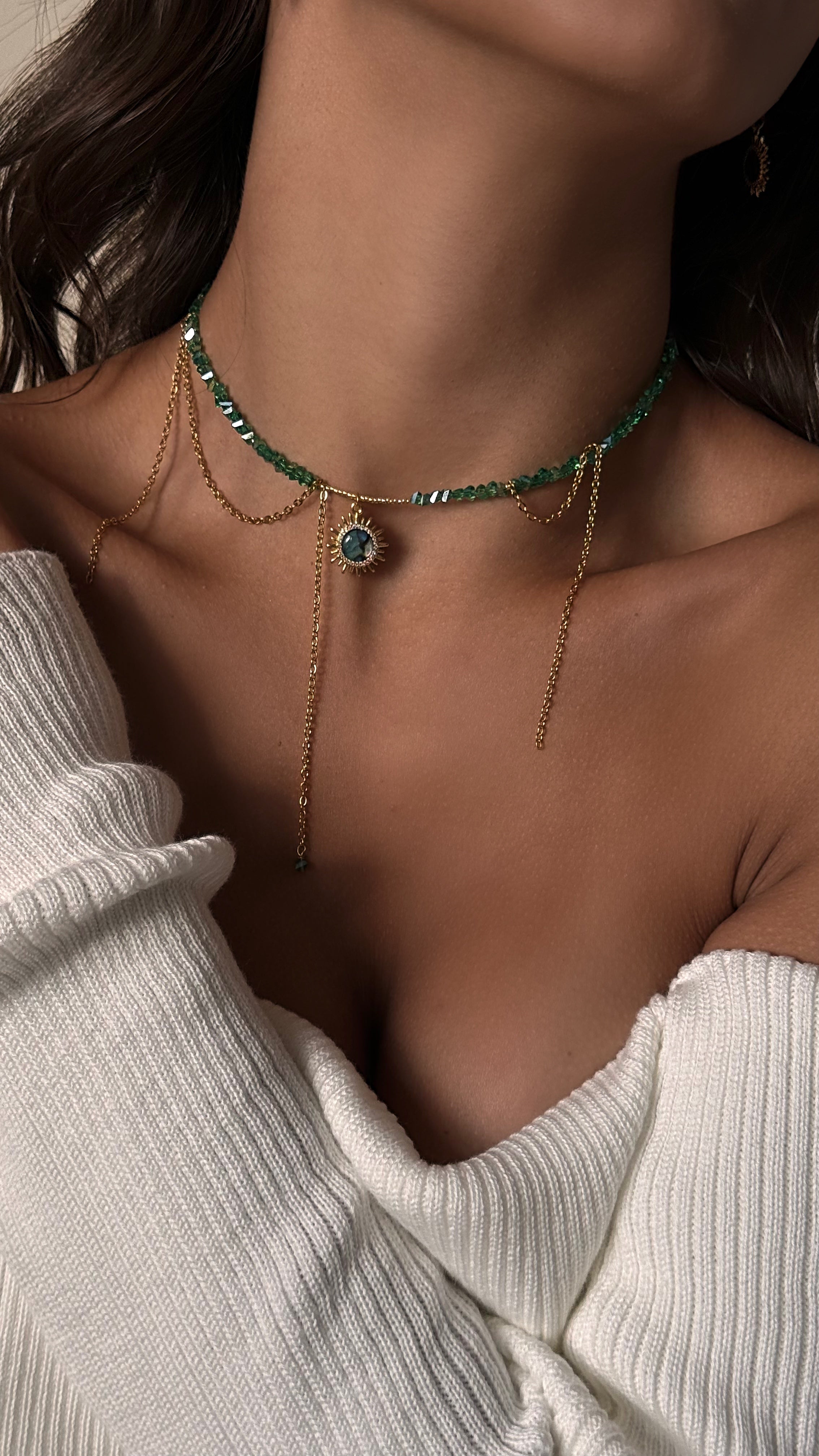 Boho crystal collar necklace with sun pendant and matching hoop earrings with dangling sun charms, celestial gold jewelry set on soft background