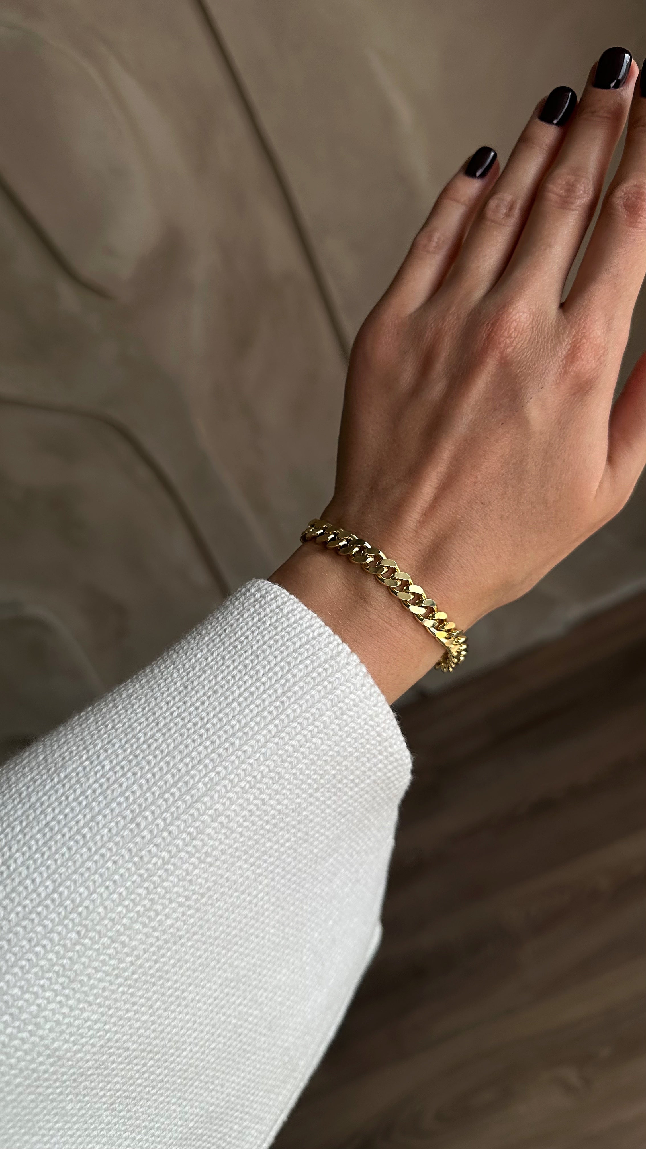 Stylish gold-plated brass bracelet with a sleek chain design, offering a modern and elegant touch to any outfit.