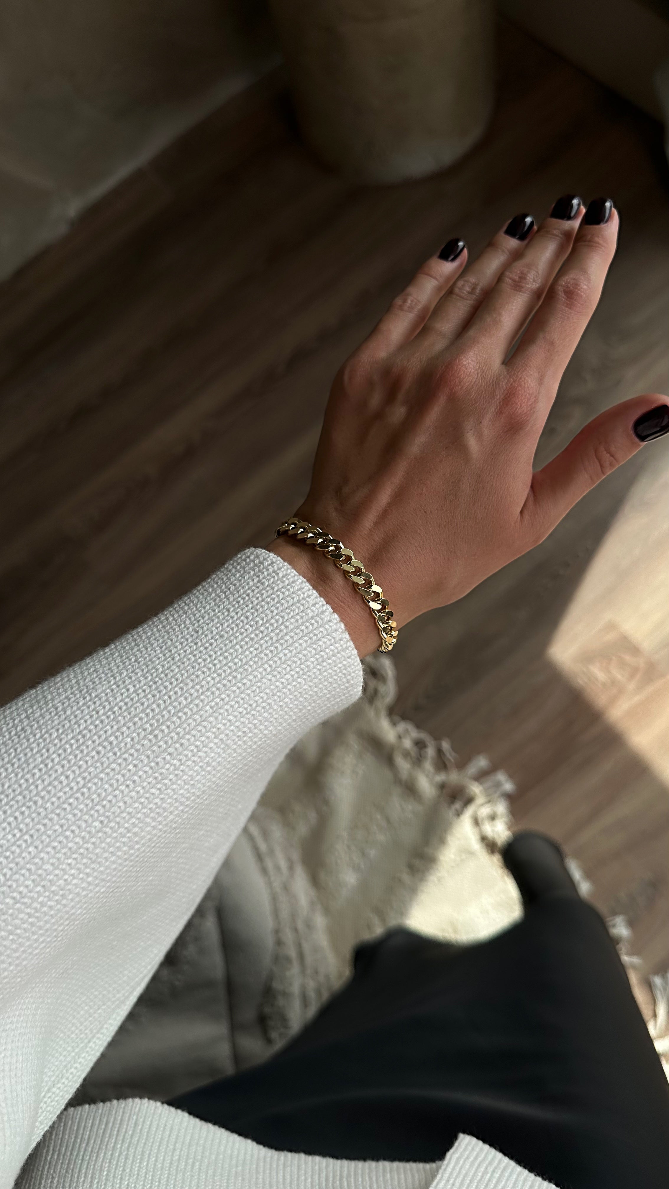 Stylish gold-plated brass bracelet with a sleek chain design, offering a modern and elegant touch to any outfit.