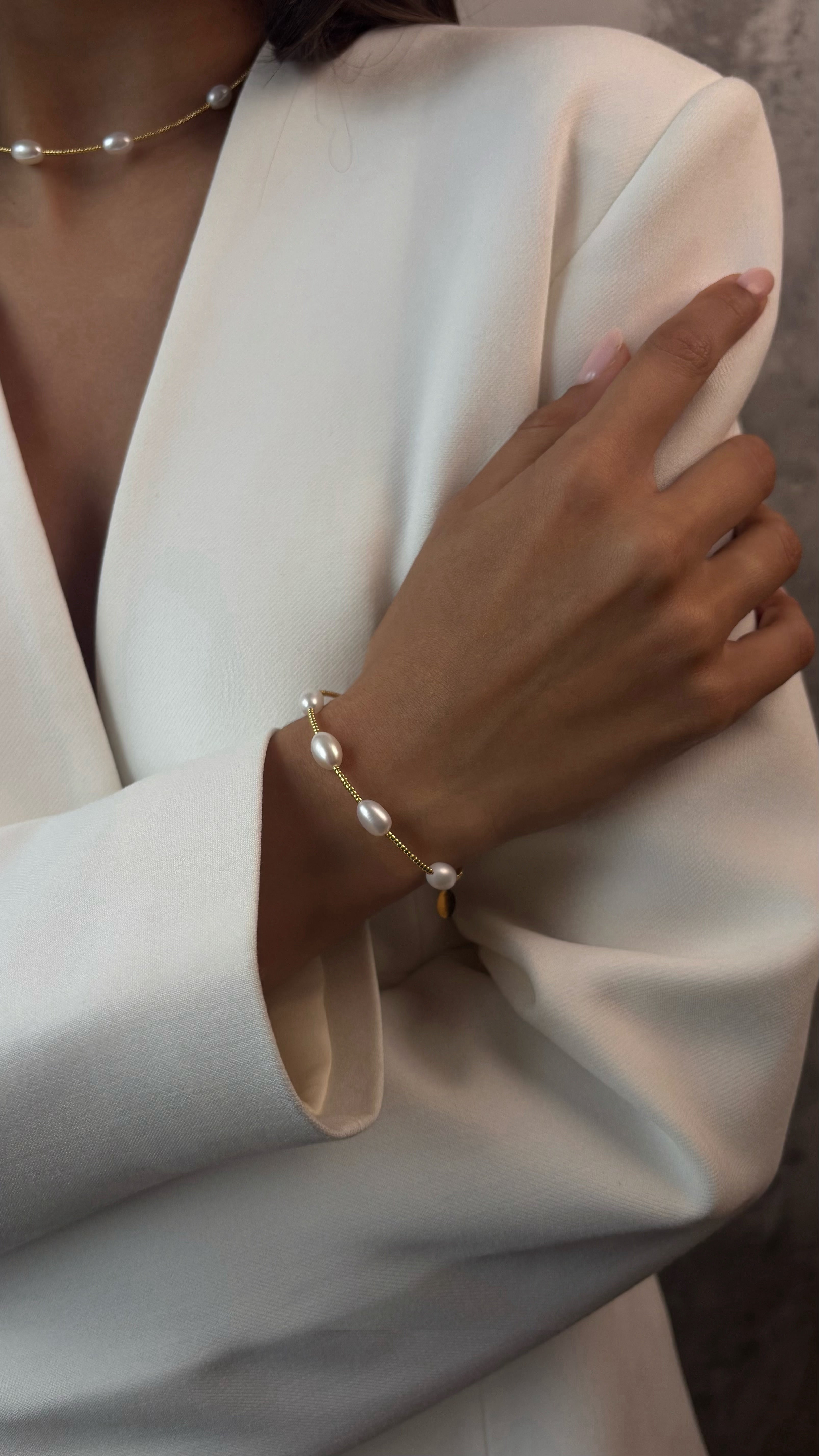 Delicate bracelet featuring Japanese jewelry-grade seed beads and natural freshwater pearls with durable galvanic coating, offering a graceful accent perfect for solo wear or layering.
