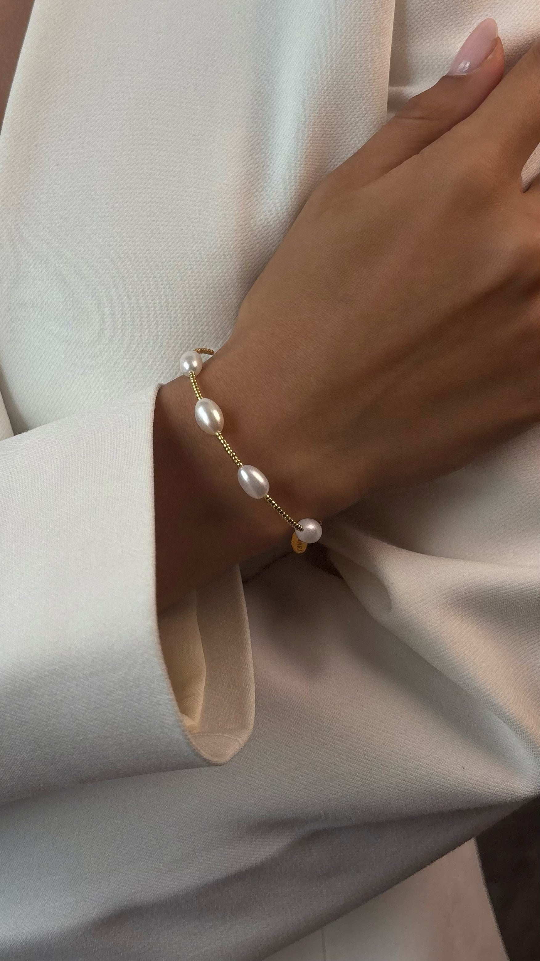 Delicate bracelet featuring Japanese jewelry-grade seed beads and natural freshwater pearls with durable galvanic coating, offering a graceful accent perfect for solo wear or layering.