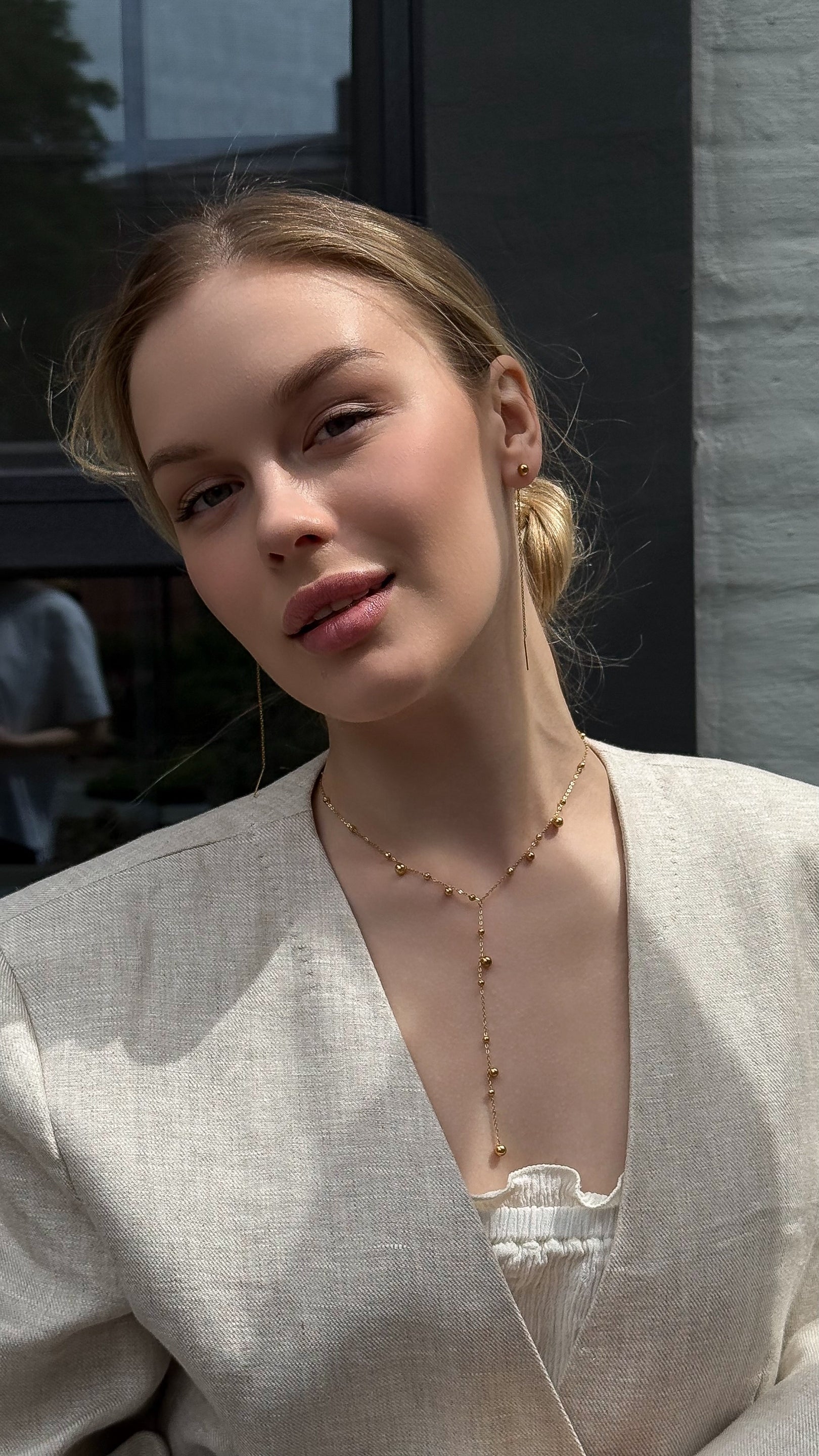 Lariat-style chain necklace with polished stainless steel beads — sleek and modern design perfect for adding minimalist elegance to both casual and formal looks.