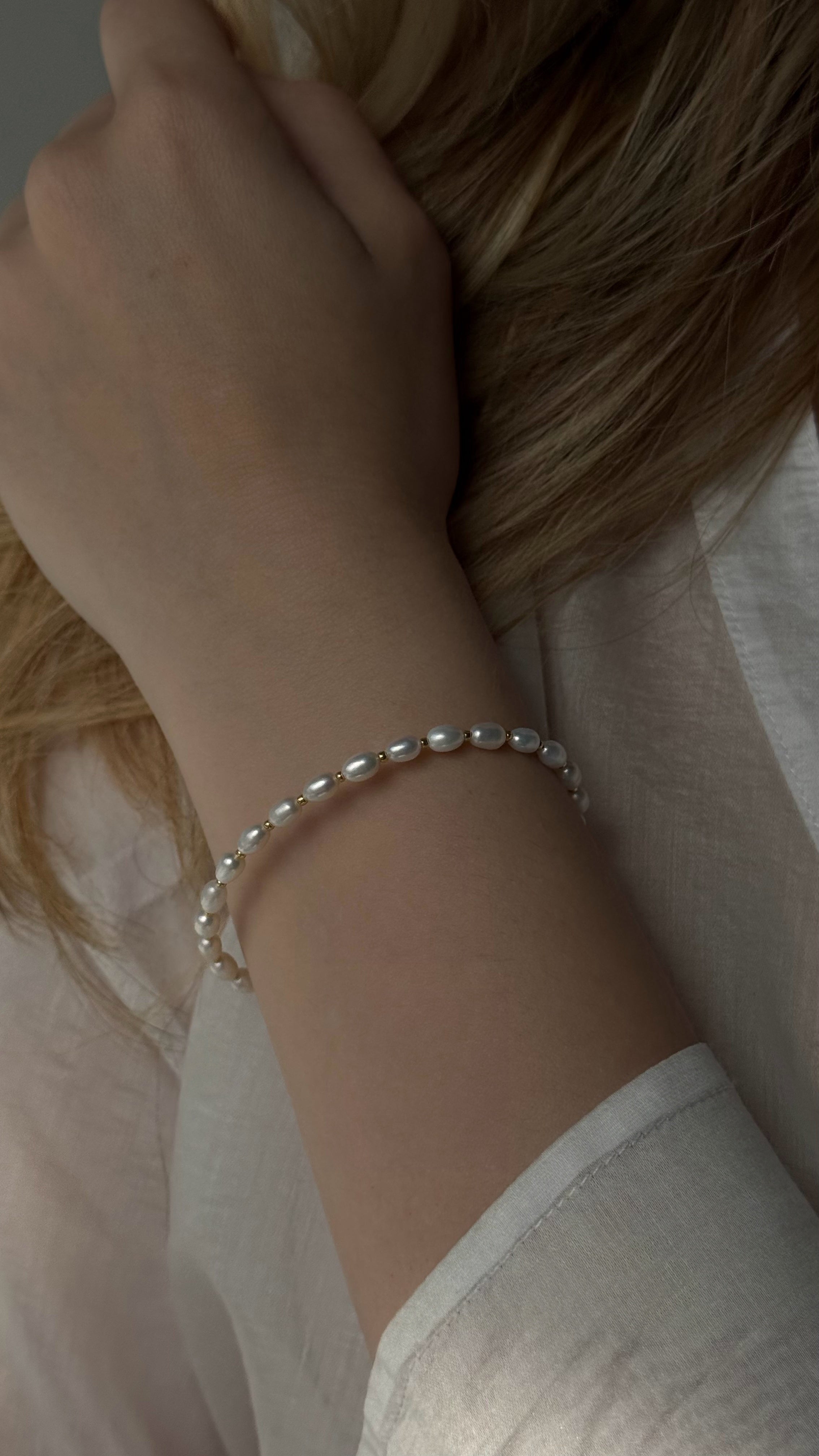 Delicate bracelet handcrafted with natural freshwater pearls and premium Japanese seed beads, offering elegant charm for everyday wear or special occasions.