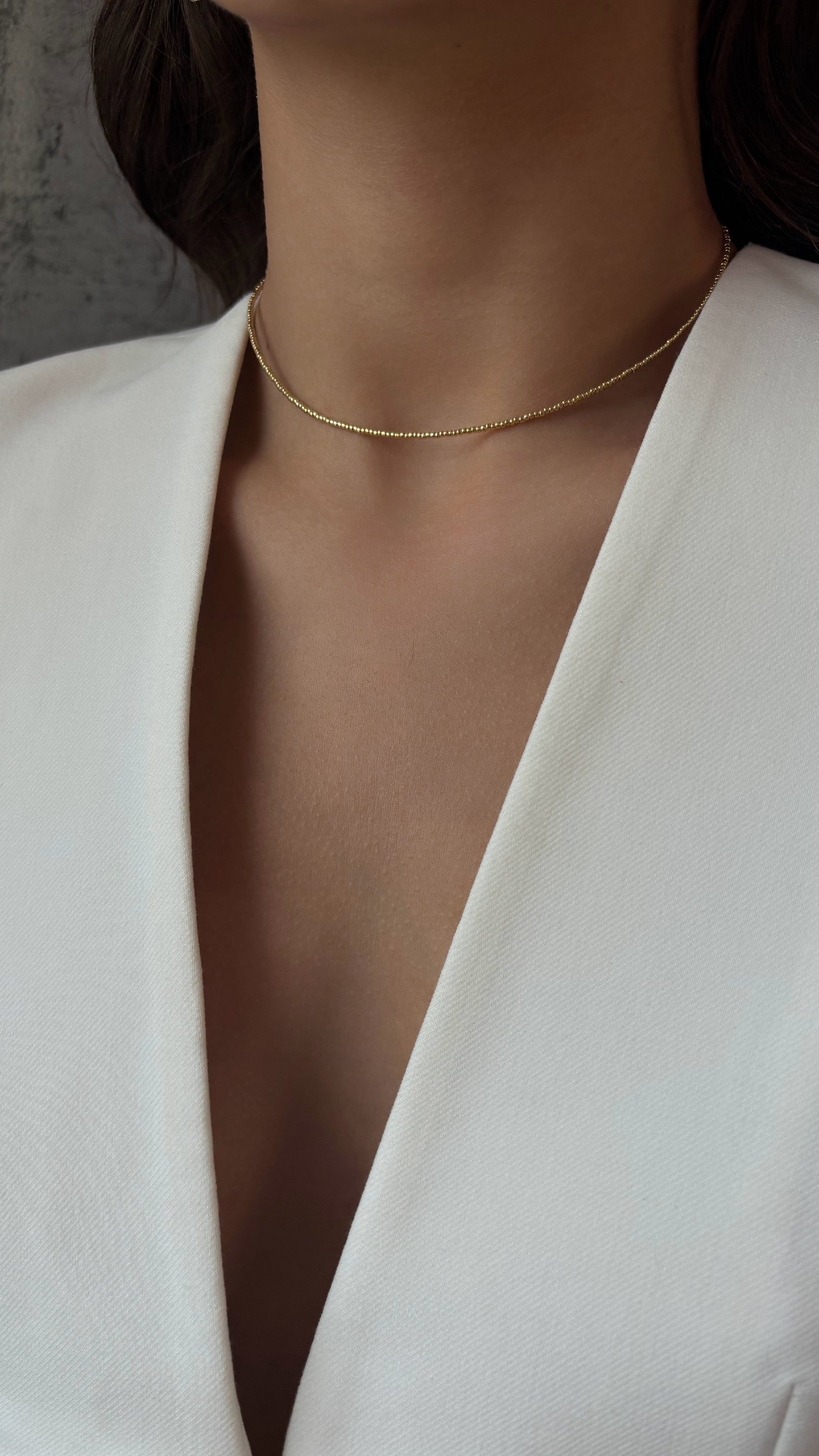 Choker made of Japanese jewelry-grade seed beads with a galvanic finish. Gold-tone stainless steel hardware. Standard length 36 cm with a 6 cm extender