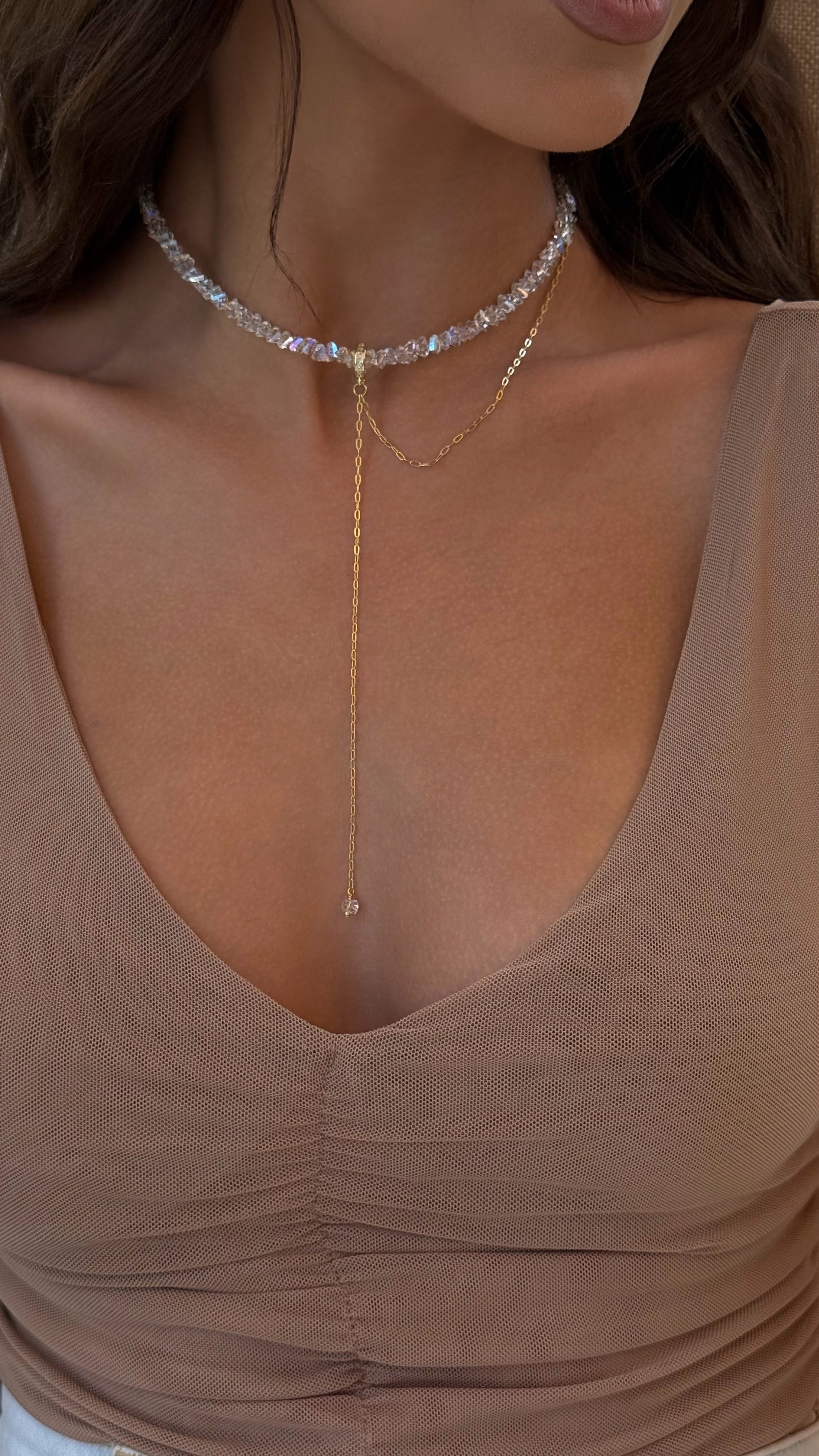 Necklace on a model wearing a beige top